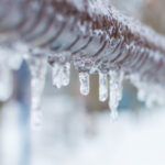 Frozen,icicles,after,rain,on,the,pipe