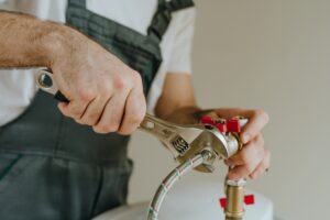 Man,fixing,water,heater.,close Up,view,of,male,hands,using