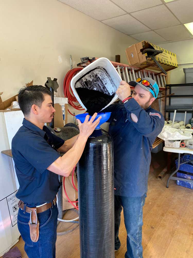 Employees Filling Container